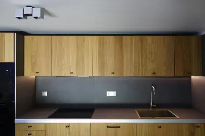 a kitchen with wooden cabinets and a sink at Madehouse - T3 indépendant-Piscine-Centre ville Aix à pied-Stationnement gratuit dans la rue in Aix-en-Provence