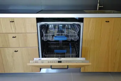 a dishwasher with its door open in a kitchen at Madehouse - T3 indépendant-Piscine-Centre ville Aix à pied-Stationnement gratuit dans la rue in Aix-en-Provence