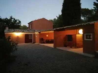 a house with a driveway in front of a building at Aix en Provence charmante villa piscine cadre verdoyant 6 personnes in Aix-en-Provence