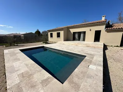 a swimming pool in front of a house at Villa en Provence avec piscine in Mollégès