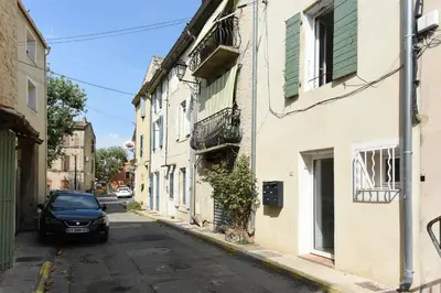 a car parked on the side of a street at Studio Lavande in La Fare-les-Oliviers