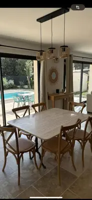 a dining room with a large table and chairs at Bastide 3 chambres 6personnes avec piscine sur Aix en Provence in Aix-en-Provence