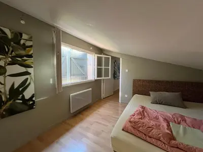 a bedroom with a bed and a window at Villa BELVENTO, superbe villa au calme, piscine, vue incroyable ! in Ventabren