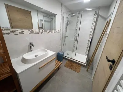 a bathroom with a sink and a shower at L'Escale in Meyreuil