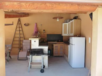 a winding staircase in a home with a chair at Pretty, spacious holiday home with private pool in Villes-sur-Auzon