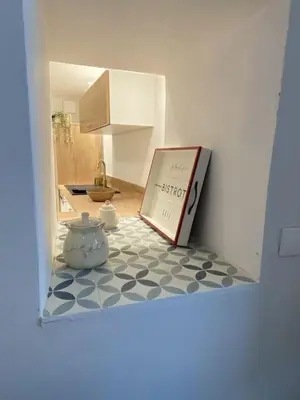 a book sitting on top of a kitchen floor at Calussine maison provençale in Pernes-les-Fontaines