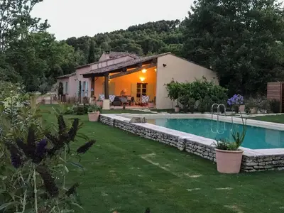 a house with a swimming pool in a yard at La Bergerie de Chateau Fontvert in Lourmarin
