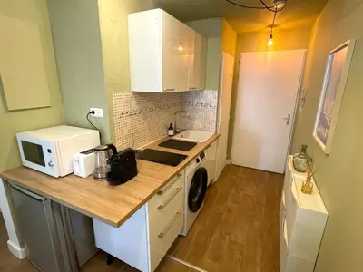 a small kitchen with a sink and a microwave at Studio Coconing Aix-en-Provence in Aix-en-Provence