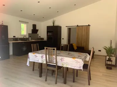 a kitchen and dining room with a table and chairs at Gîte Lavande Luberon in Saint-Saturnin-les-Apt