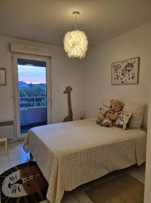 a bedroom with a bed with two teddy bears on it at T3 Panoramique Centre Aix en Provence in Aix-en-Provence