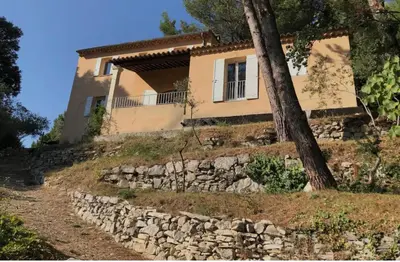 a house on top of a hill with a tree at Casa Lub in Apt