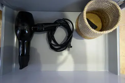 a pair of shoes and a hat in a drawer at Anna et Jean-Paul in LʼIsle-sur-la-Sorgue