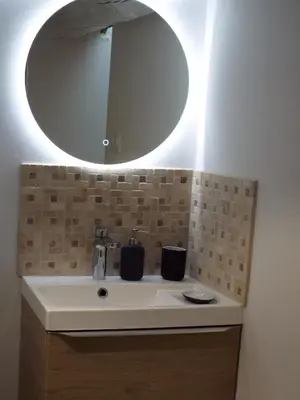 a bathroom with a sink and a mirror at Valentins cottage Moulin de Tartay Avignon in Avignon