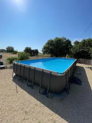a large swimming pool in a boat on the ground at Domaine Camp Fourca in Mirabeau