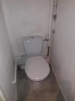 a bathroom with a white toilet in a stall at Studio 107 in Aix-en-Provence