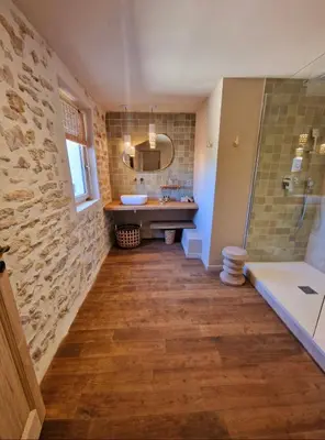 a bathroom with a sink and a shower and a mirror at Bastide des 7 Sœurs in Roussillon