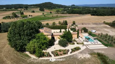 an overhead view of a mansion with a pool and trees at Bastide des 7 Sœurs in Roussillon