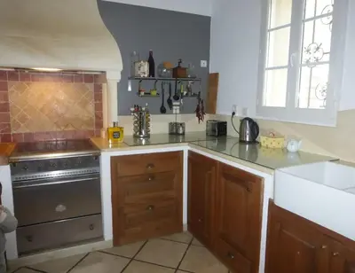 a kitchen with a stove and a counter top at Mas Aubert in Eyragues