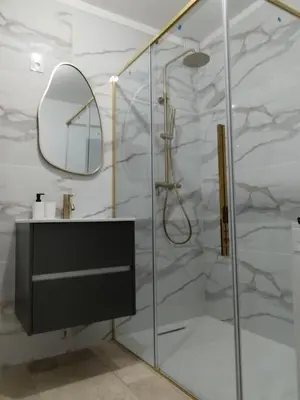 a bathroom with a shower with a sink and a mirror at Mas en Provence in Le Thor