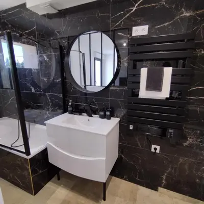 a bathroom with a white sink and a mirror at Mas en Provence in Le Thor
