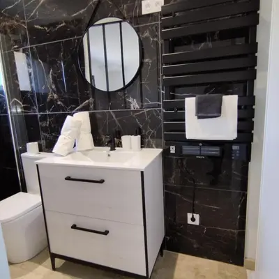 a bathroom with a white sink and a mirror at Mas en Provence in Le Thor