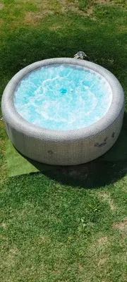 a bath tub in the middle of the grass at Mas en Provence in Le Thor