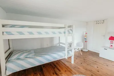 a bunk bed room with two bunk beds at Le Bas Château Provence Luberon in Saint-Michel-lʼObservatoire