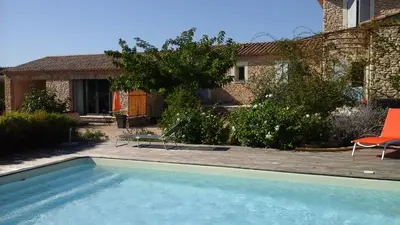 a swimming pool in the yard of a house at La cigale bleue in Gordes