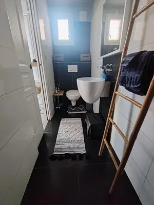 a small bathroom with a sink and a toilet at Chambre d'hôtes privée et indépendante avec piscine in Salon-de-Provence