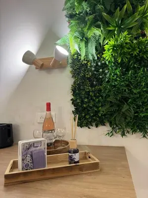 a tray with a bottle of wine and glasses on a table at Appartement T2 Cosy centre-ville in Pernes-les-Fontaines