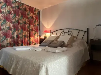 a bedroom with a bed with towels on it at La Louvière Plaine d'Eygalières in Orgon
