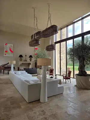 a bedroom with a bed and a dresser and a piano at Bastide Hedone en Luberon in Apt