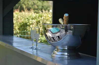 a glass bowl with wine glasses on a counter at Le petit paradis au cœur du Luberon in Saint-Saturnin-les-Apt