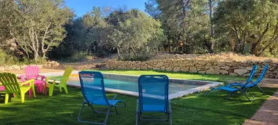 a group of chairs sitting next to a pool at Mazet in Rognes