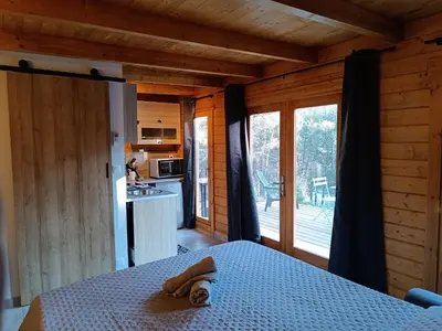 a bedroom with a bed with a towel on it at Escapade sous les pins 20m2 in Aurons