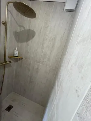 a shower with a glass door in a bathroom at Gîte en Provence pour amoureux de la nature in Rognes