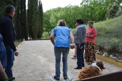 a group of people standing next to a dog at Moulin des Gypses Gîte l'Oliveraie, Ventoux in Mormoiron