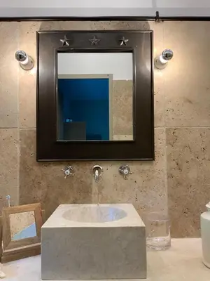 a bathroom with a sink and a mirror at La Cour Intérieure Ménerbes in Ménerbes