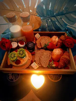 a tray of food with bread and other foods and drinks at Multiverse Suite immersive in Charleval