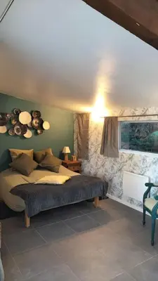 a bedroom with a bed and a window at le 1387 l'étape en Provence in Plan-dʼOrgon