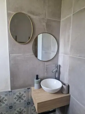 a bathroom with a sink and a mirror at Nel Home in Mazan