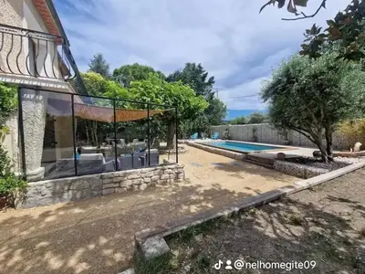a villa with a swimming pool and a house at Nel Home in Mazan