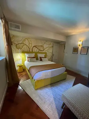 a bedroom with a large bed in a room at Bastide Farandole in Eygalières