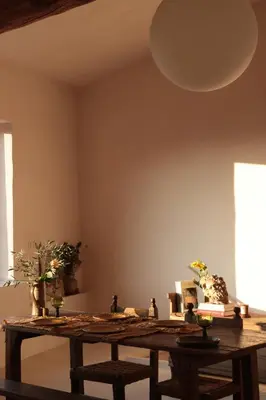 a room with a wooden table with plants on it at Casa Pauseto in Bonnieux