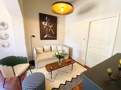 a living room with a couch and a table at Mazet Cordelles Alpilles in Eygalières