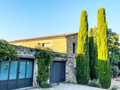 a house with cypress trees and a garage at Holiday Home Villa Montagne by Interhome in Oppède