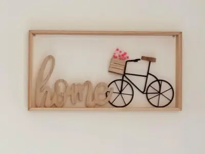 a framed picture of a bike on a wall at Le petit gîte de Rosalie in Blauvac