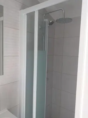 a shower with a glass door in a bathroom at 2 Voyageurs - 1 Lit - Proche de toutes commodités in Peyrolles-en-Provence