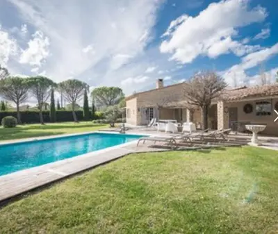a swimming pool in front of a house at villa avec piscine à Gordes, en Provence in Gordes