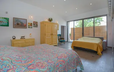 a bedroom with two beds and a dresser and a window at Stunning Home In Noves With Wifi in Noves